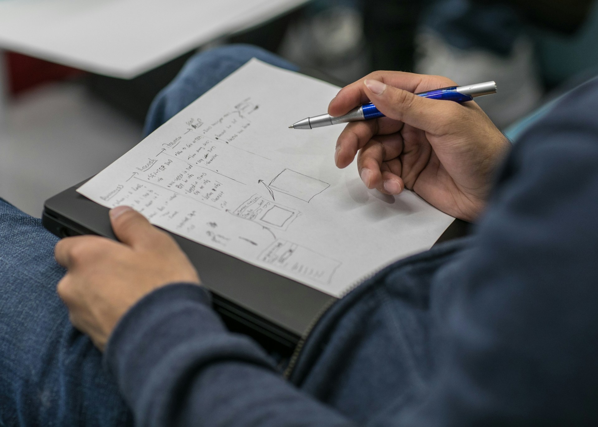 Researcher writing notes